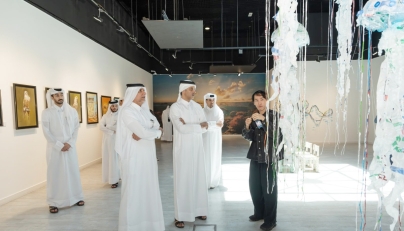 Officials and visitors at the exhibition.