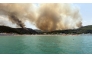 This photograph obtained from Italian news agency Ansa shows a vast wildfire spreading in the forest near the Adriatic sea resort of Peschici, in the southeastern Italy province of Puglia on July 26, 2026. (Photo by ANSA / AFP)