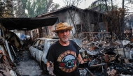 Jose Fernandez is pictured at his burnt-out home following a devastating wildfire in Pelayos de la Presa, 65 kilometers west of Madrid, on July 28, 2026. (Photo by Pierre-Philippe Marcou / AFP)
