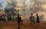 Volunteers and firefighters battle a wildfire in Fethiye, in the province of Mugla, southwestern Turkey on July 30, 2026. (Photo by Murat Kocabas / AFP)
