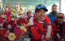 (Files) Nepal's climber Nirmal Purja (C) watches upon his arrival along with his team at the airport in Islamabad on January 21, 2021. (Photo by Farooq Naeem / AFP)