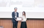 A Qatar Museums representative receives the award from an official during the ceremony in Busan, Republic of Korea.
