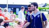 Al Wakrah players are greeted by young fans in Rennes, France.