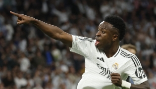 (FILES) Real Madrid's Brazilian forward #07 Vinicius Junior celebrates scoring his team's first goal during the UEFA Champions League quarter final second leg football match between Real Madrid CF and Arsenal at Santiago Bernabeu Stadium in Madrid on April 16, 2025. (Photo by Pierre-Philippe MARCOU / AFP)
