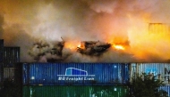This photograph shows a fire in construction waste at a recycling company near the port of Rotterdam, in Rotterdam on August 7, 2026. (Photo by Jeffrey Groeneweg / ANP / AFP)
 