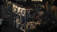 This aerial view shows the rubble of a collapsed building in Cali, Colombia, on August 13, 2026, three days after a 7.4-magnitude earthquake. Photo by Raul ARBOLEDA / AFP