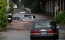 Abandoned cars are seen partially submerged on a flooded road in Sakura, Chiba prefecture on August 14, 2026. Photo by ANDREW CABALLERO-REYNOLDS / AFP