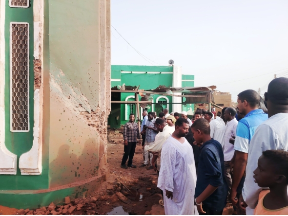 This photo taken with a mobile phone shows residents inspecting a drone-attacked mosque in Al-Droshab, north of Sudan's capital Khartoum on Aug. 12, 2026. (Photo by Mohamed Khidir/Xinhua)