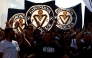 Supporters of French 'Nationale 2' fourth-tier club FC Girondins de Bordeaux wave the club’s flags during a protest ahead of a hearing at the Direction Nationale du Controle de Gestion - DNGG, French football financial watchdog, following the six-time French champions' exclusion from national competitions, in Bordeaux, southwestern France July 19, 2026. Photo by ROMAIN PERROCHEAU / AFP