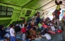 Villagers rest in a tent on an open field in Marapokot, Nagekeo, East Nusa Tenggara, on August 17, 2026, following a 7.7-magnitude earthquake. T (Photo by JUNI KRISWANTO / AFP)