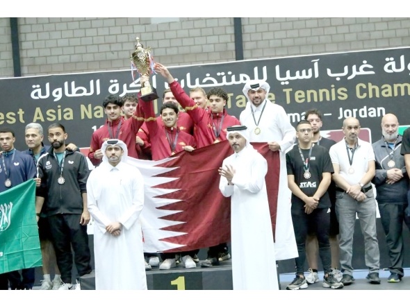 Qatar Table Tennis Association officials pose for photos with victorious Team Qatar players. 