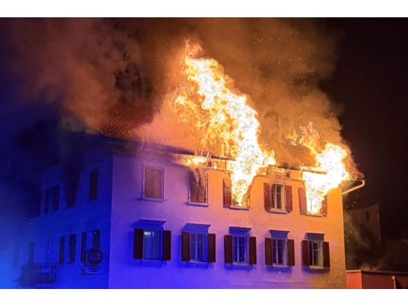 This handout photograph taken and released on August 21, 2026 by the Cantonal Police of Graubunden (Kantonspolizei Graubunden) shows a fire that broke out in a building in the small town of Thusis, eastern Switzerland. Photo by Handout / Kantonspolizei Graubünden / AFP