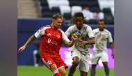 Action during the match between Al Duhail and Al Arabi.
