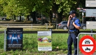 Police officers secure the area next to a poster advertising a rave where a shooting occurred, in Aarau, northern Switzerland, on August 30, 2026. Photo by Harold CUNNINGHAM / AFP