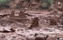 This handout image released by the Grand Canyon National Park Service via X (formerly Twitter) on August 30, 2026 shows remnants of stone bridge pylons along Bright Angel Creek following a flash flood that destroyed the footbridge on August 29. Photo by J.THOMPSON and Handout / NATIONAL PARK SERVICE / AFP