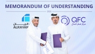 CEO of QFC Mansoor Rashid Al-Khater and Group CEO of AlRayan Bank Fahad bin Abdulla Al Khalifa during the MoU signing.