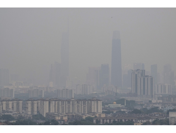Haze shrouds the Kuala Lumpur skyline as seen from Ampang, in Malaysia's Selangor state, on September 3, 2026. Photo by Mohd Rasfan / AFP