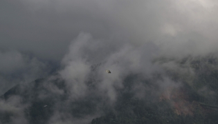 A helicopter takes off from a temporary relief camp in the aftermath of flash floods at Trishuli Bazar, Nepal's Nuwakot district, on September 6, 2026. (Photo by Prakash MATHEMA / AFP)
 
