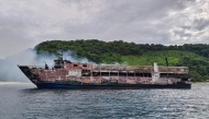 This handout photo taken and received from the Philippine Coast Guard (PCG) on September 10, 2026 shows the ruins of a ferry that caught fire off Palawan. (Photo by Handout / Philippine Coast Guard (PCG) / AFP) 