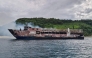 This handout photo taken and received from the Philippine Coast Guard (PCG) on September 10, 2026 shows the ruins of a ferry that caught fire off Palawan. (Photo by Handout / Philippine Coast Guard (PCG) / AFP) 