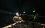 Workers from Herdade das Servas winery take part in a night grape harvesting in Estremoz on September 3, 2026. (Photo by Patricia De Melo Moreira / AFP)