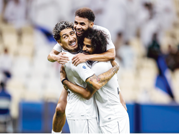 FROM LEFT: Al Sadd's Roberto Firmino, Hashem Ali and Akram Afif celebrate a goal.