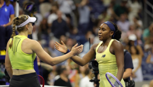 Kazakhstan's Elena Rybakina goes in to hug USA's Coco Gauff after their women's singles semi-final tennis match on day twelve of the US Open tennis tournament at the USTA Billie Jean King National Tennis Center in New York City on September 10, 2026. (Photo by KENA BETANCUR / AFP)