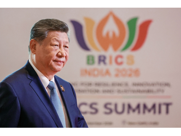 In this pool photograph distributed by the Russian state agency Sputnik, China's President Xi Jinping arrives before the start of the 18th BRICS Summit in New Delhi on September 12, 2026. (Photo by Alexander Kazakov / Pool / AFP)