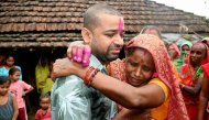 Nepali hydropower worker Sanjay Sah (L) breaks down after meeting his mother at his residence in Nepal's Saptari district on September 13, 2026 after being rescued. (Photo by Deepesh Deo Joshi / AFP)