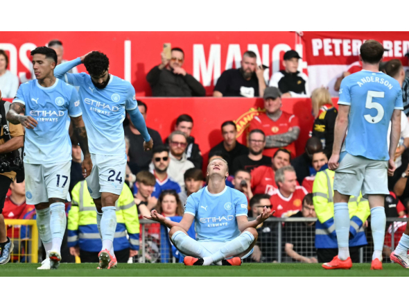 Manchester City's Norwegian striker #09 Erling Haaland celebrates scoring the team's first goal during the English Premier League football match between Manchester United and Manchester City at Old Trafford in Manchester, north-west England, on September 13, 2026. (Photo by Paul ELLIS / AFP)
