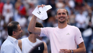 Alexander Zverev of Germany celebrates with the winner's check after defeating Ben Shelton of the United States in their Men's Singles Final match on Day Fifteen of the 2026 US Open at USTA Billie Jean King National Tennis Center on September 13, 2026 in the Flushing neighborhood of the Queens borough of New York City. (Photo by  Matthew Stockman/Getty Images/AFP) 