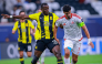 Al Shamal's Baghdad Bounedjah (right) and Al Ittihad's Dion Lopy vie for the ball.