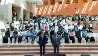 Dean Michael Trick with faculty members and students. 