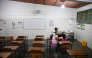 A teacher talks to her students during a class at the beginning of the school year in La Guaira, Venezuela on September 15, 2026.  (Photo by Federico PARRA / AFP)