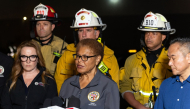 Los Angeles Mayor Karen Bass (C) briefs reporters after a US news media helicopter covering a deadly bus crash, came down in Chatsworth, a neighborhood of Los Angeles, California on September 15, 2026. (Photo by Blake Fagan / AFP)