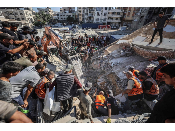Rescuers excavate rubble to retrieve bodies from a collapsed building in the Tal al-Hawa area of Gaza City on September 16, 2026. (Photo by Omar Al-Qattaa / AFP)