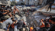 Rescuers excavate rubble to retrieve bodies from a collapsed building in the Tal al-Hawa area of Gaza City on September 16, 2026. (Photo by Omar Al-Qattaa / AFP)