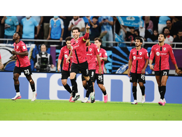 Al Rayyan's David García (third left) celebrates after scoring a goal.