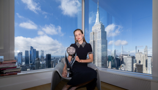 Elena Rybakina of Kazakhstan poses with the Chris Evert WTA World No. 1 Trophy.