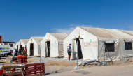 This picture shows large tents at the new Los Rosales migrant reception camp, where more than 800 people have been transferred from the Loma Colmenar camp, in Ceuta, on September 12, 2026. Photo by ANTONIO SEMPERE / AFP

