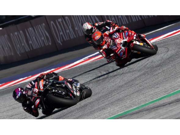 Aprilia Racing's Spanish driver Jorge Martin (L) and Ducati Lenovo Team's Spanish driver Marc Marquez compete during the Sprint event of the Grand Prix of Austria MotoGP in Spielberg bei Knittelfeld, Austria, on September 19, 2026. (Photo by Joe Klamar / AFP)
