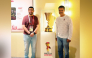 Qatar rally driver and Olympic bronze medallist in shooting Nasser Al Attiyah (right) poses with the Naismith Trophy at the Qatar House in Nagoya, yesterday.