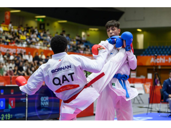 Qatar's Abdullah Rashad Mohi El Din Babiker in action against Palestine’s Abdullah Al Khatib.