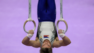 Philippines' Carlos Edriel Yulo competes on the rings in the men's artistic gymnastics team final during the 2026 Asian Games at the Nagoya City General Gymnasium in Nagoya, Aichi prefecture on September 23, 2026. (Photo by DAVID GRAY / AFP)