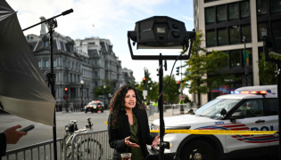 MS Now White House Correspondent Laura Barrَn-Lَpez works on a street corner near the White House in Washington, DC, on September 24, 2026. Photo by Mandel NGAN / AFP
