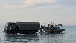In this undated handout photograph released by the Kazakh Defence Ministry on September 25, 2026, Kazakh military personnel conduct search and rescue operations at an undisclosed location in the waters of the Caspian Sea. Photo by Handout / KAZAKH DEFENCE MINISTRY / AFP