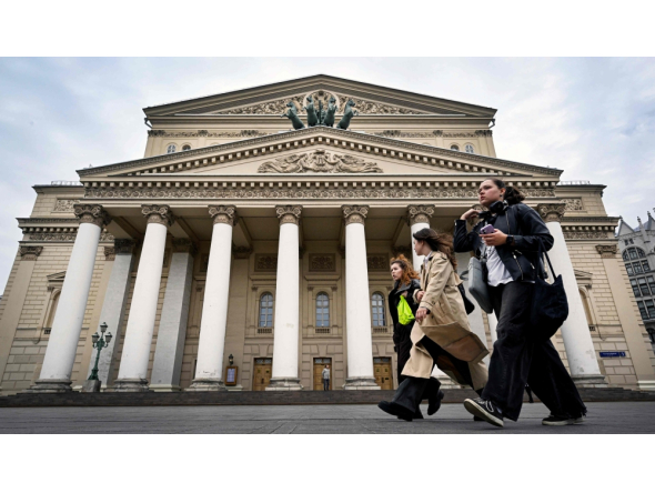 Women walk in front of the Bolshoi Theatre in Moscow on September 24, 2026. (Photo by Alexander Nemenov / AFP)