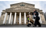 Women walk in front of the Bolshoi Theatre in Moscow on September 24, 2026. (Photo by Alexander Nemenov / AFP)