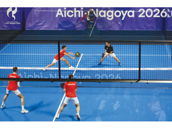 Japan’s Teruaki Ando and Shinnosuke Nakamura (top) play against Lebanon’s Tamim El Hallak and Ralph Tohme during the men’s pairs padel first round match at the Asian Games.