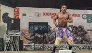Nigerian dancer Benjamin Daniel Gabriel, 32, dances on stage to set a new world record for the longest individual dance marathon in Lagos on September 29, 2026. (Photo by Tonye Bakare / AFP)